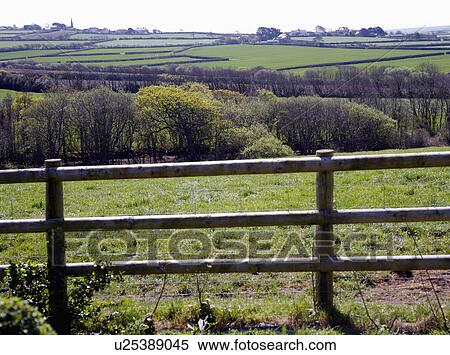Wooden fence bordering English country fields View Large Photo Image Stock Photography - Wooden fence bordering English country fields. Fotosearch
