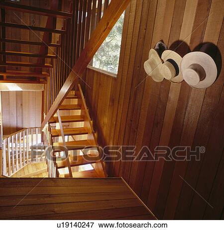 Stock Photo - Wooden walls and staircase in modern hall. Fotosearch