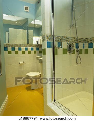 Yellow floor in modern tiled shower room View Large Photo Image Picture - Yellow floor in modern tiled shower room. Fotosearch