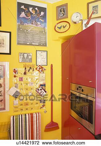 Yellow kitchen with oven in fitted pink unit View Large Photo Image Stock Image - Yellow kitchen with oven in fitted pink unit. Fotosearch