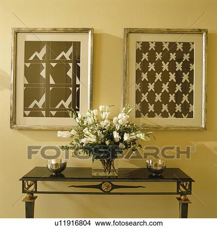 Abstract pictures above console table in cream hall View Large Photo Image Picture - Abstract pictures above console table in cream hall. Fotosearch