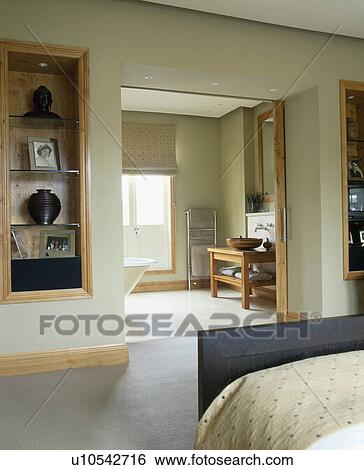Alcove shelves beside doorway to modern ensuite bathroom View Large Photo Image Stock Photograph - Alcove shelves beside doorway to modern ensuite bathroom. Fotosearch
