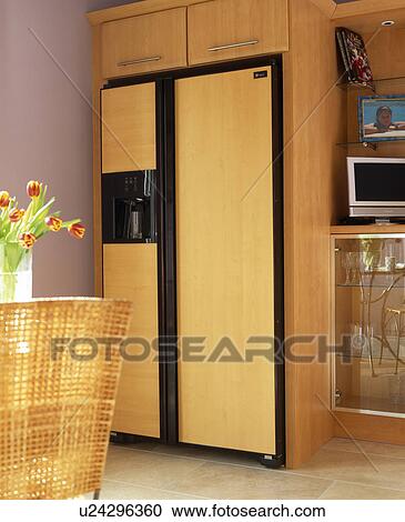 American-style refrigerator with wood veneer panelling View Large Photo Image Stock Image - American-style refrigerator with wood veneer panelling. Fotosearch