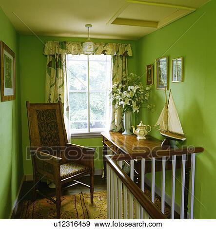 Antique chair on bright green traditional landing View Large Photo Image Stock Photo - Antique chair on bright green traditional landing. Fotosearch