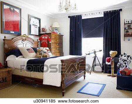 Antique mahogany bed in child's bedroom with black curtains View Large Photo Image Stock Photography - Antique mahogany bed in child's bedroom with black curtains . Fotosearch