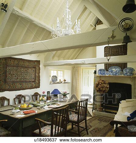 Antique Table And Chairs In Barn Conversion Dining Room With