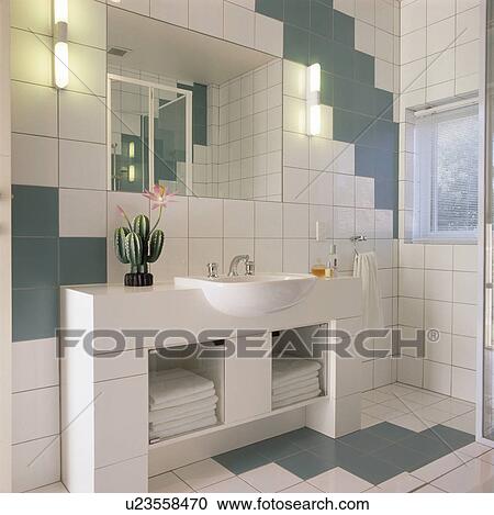 Basin in vanity unit with storage shelves in modern tiled bathroom View Large Photo Image Stock Image - Basin in vanity unit with storage shelves in modern tiled bathroom. Fotosearch