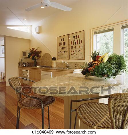 Basket of vegetables on marble table in modern kitchen View Large Photo Image Stock Photo - Basket of vegetables on marble table in modern kitchen. Fotosearch