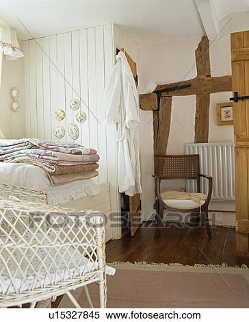 Stock Photography - Beamed walls in cottage bedroom. Fotosearch