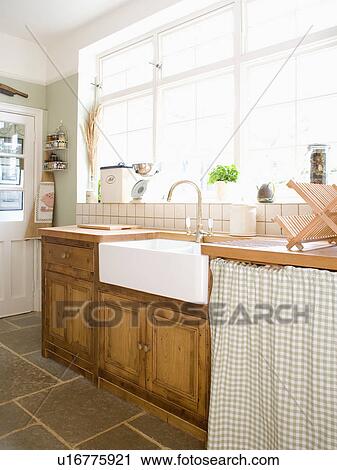Belfast sink in fitted pine cupboards in country kitchen View Large Photo Image Stock Image - Belfast sink in fitted pine cupboards in country kitchen. Fotosearch