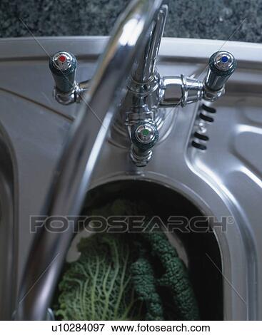 Birdseye close-up of stainless steel sink and mixer-tap View Large Photo Image Stock Photo - Birdseye close-up of stainless steel sink and mixer-tap. Fotosearch