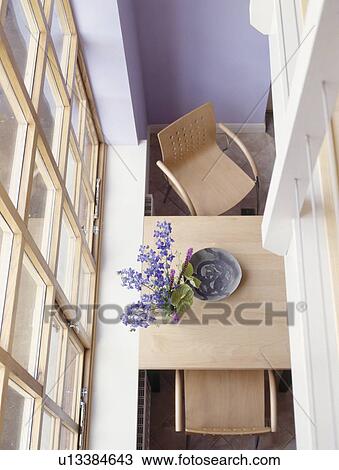 Birdseye view of wooden table in modern blue dining room View Large Photo Image Stock Image - Birdseye view of wooden table in modern blue dining room. Fotosearch