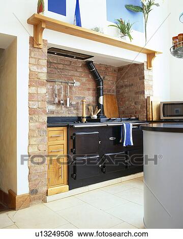 Black Aga oven in modern country kitchen View Large Photo Image Stock Photo - Black Aga oven in modern country kitchen. Fotosearch