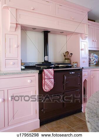 Black Aga oven in pastel pink country kitchen View Large Photo Image Stock Photo - Black Aga oven in pastel pink country kitchen. Fotosearch