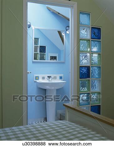 Blue glass bricks beside door to blue ensuite bathroom View Large Photo Image Stock Photo - Blue glass bricks beside door to blue ensuite bathroom. Fotosearch