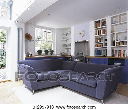 Stock Image - Blue sofas in modern white living room. Fotosearch