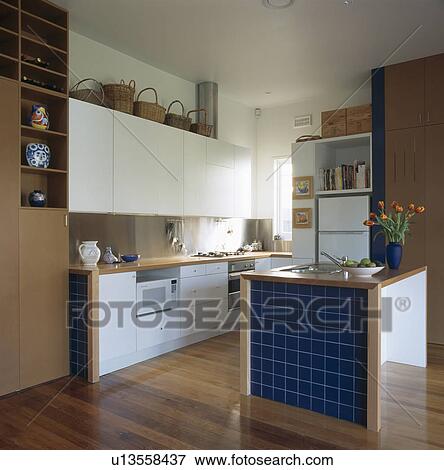 Blue tiles on island unit in moden kitchen View Large Photo Image Stock Photo - Blue tiles on island unit in moden kitchen. Fotosearch
