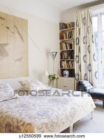 Blue+white Liberty print curtains and quilt in modern bedroom View Large Photo Image Stock Photo - Blue+white Liberty print curtains and quilt in modern bedroom. Fotosearch