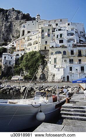 Stock Image - Boat moored at quayside, Amalfi, Amalfi Coast, Campania, Italy. Fotosearch