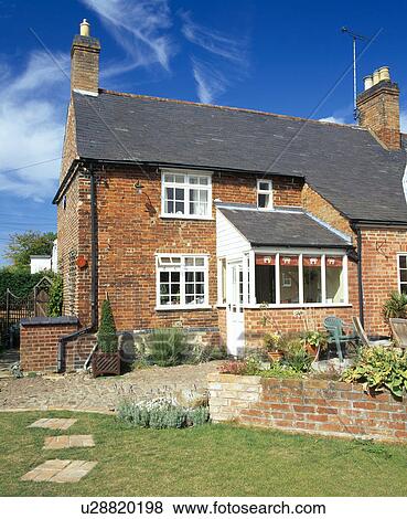 Brick country cottage with small porch extension View Large Photo Image Stock Photo - Brick country cottage with small porch extension. Fotosearch