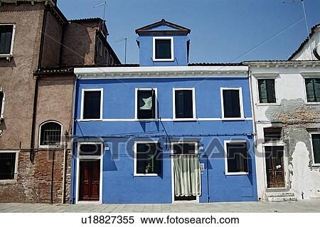 Stock Photography - Bright blue house on Venetian street&#10;. Fotosearch