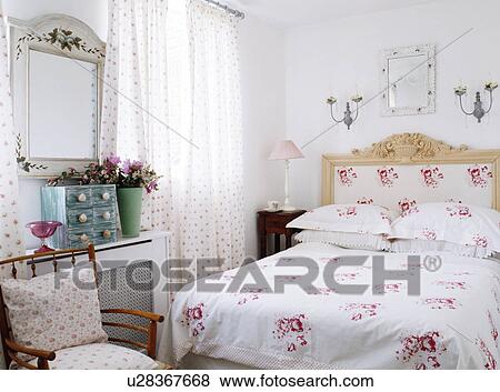 Brightly striped pillows and bedcover on bed in modern bedroom View Large Photo Image Stock Photo - Brightly striped pillows and bedcover on bed in modern bedroom. Fotosearch