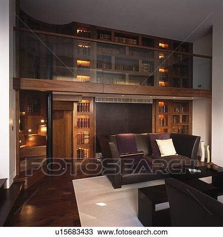 Brown leather sofa in modern library living room View Large Photo Image Stock Image - Brown leather sofa in modern library living room. Fotosearch
