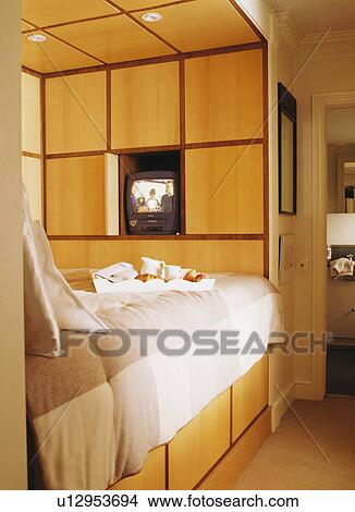 Picture - Built-in bed with concealed storage in modern bedroom. Fotosearch