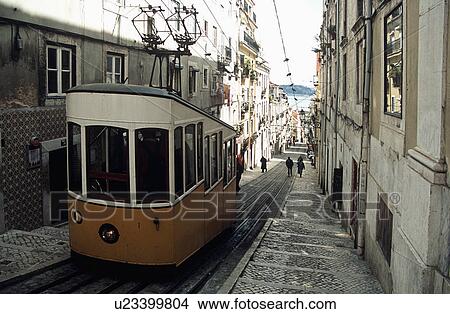 Cable car on hilly street in Lisbon Portugal View Large Photo Image Picture - Cable car on hilly street in Lisbon Portugal . Fotosearch