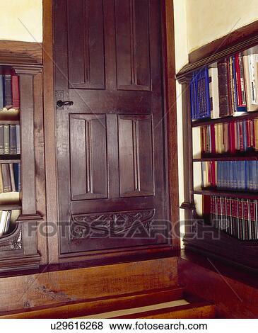Stock Photo - Carved door in traditional library. Fotosearch
