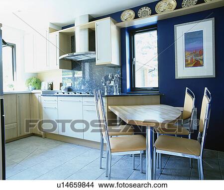 Chairs at fitted table in modern kitchen View Large Photo Image Picture - Chairs at fitted table in modern kitchen. Fotosearch