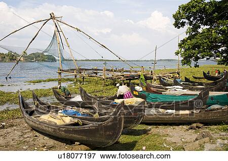Stock Photo - Chinese fishing nets, boats and fishermen, Fort Cochin, Cochin, Kerala, India. Fotosearch