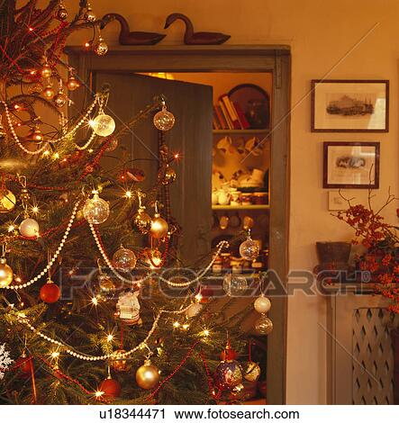 Stock Image - Christmas tree in traditional living room. Fotosearch