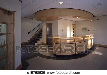 Circular Reception Desk In Modern Office Block Stock Photograph