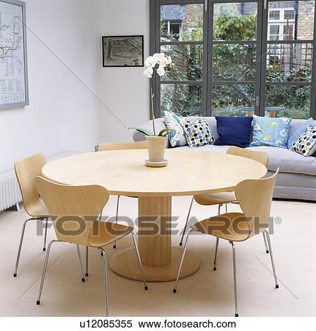 Circular table and Arne Jacobsen Ant chairs in modern dining room View Large Photo Image Stock Photography - Circular table and Arne Jacobsen Ant chairs in modern dining room. Fotosearch