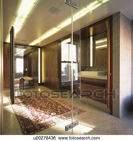Clear glass doors to modern bathroom View Large Photo Image Stock Photograph - Clear glass doors to modern bathroom. Fotosearch