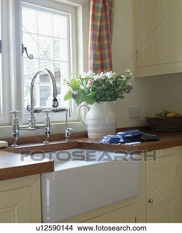 Close-up of Belfast sink below kitchen window View Large Photo Image Picture - Close-up of Belfast sink below kitchen window. Fotosearch