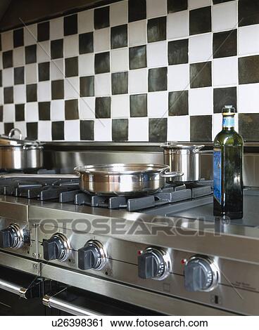 Close-up of black+white wall tiles above large range oven View Large Photo Image Stock Image - Close-up of black+white wall tiles above large range oven. Fotosearch