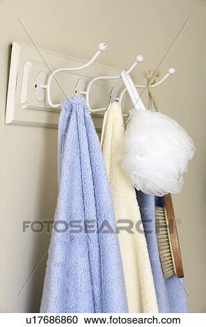 Close-up of blue and cream towels on hooks on pegboard View Large Photo Image Stock Image - Close-up of blue and cream towels on hooks on pegboard. Fotosearch