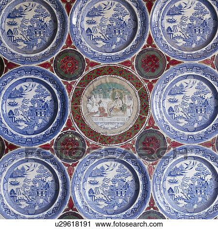 Stock Image - Close-up of blue+white antique Willowpattern plates with old Rajastani plate. Fotosearch