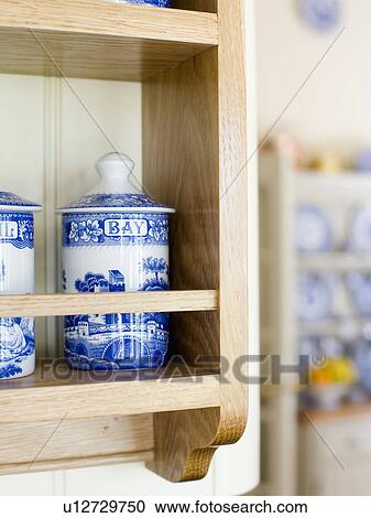 Close-up of blue+white china storage jars on small wooden shelf unit View Large Photo Image Stock Image - Close-up of blue+white china storage jars on small wooden shelf unit. Fotosearch