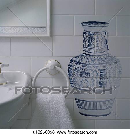 Close-up of blue+white vase hand-painted onto white tiled wall View Large Photo Image Stock Photo - Close-up of blue+white vase hand-painted onto white tiled wall. Fotosearch