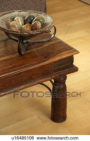 Close-up of bowl of marble eggs on wooden coffee-table View Large Photo Image Stock Photograph - Close-up of bowl of marble eggs on wooden coffee-table. Fotosearch