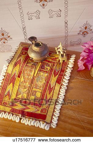 Close-up of brass pot on yellow and red Rajastani rug View Large Photo Image Stock Photo - Close-up of brass pot on yellow and red Rajastani rug. Fotosearch