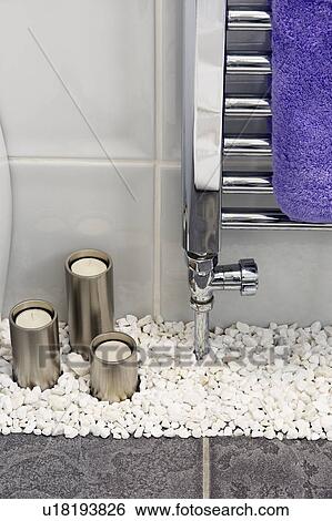 Close-up of candles in stainless steel holders on pebbles floor View Large Photo Image Stock Photograph - Close-up of candles in stainless steel holders on pebbles floor. Fotosearch