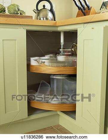 Close-up of carousel unit in pastel green kitchen cupboard View Large Photo Image Stock Photograph - Close-up of carousel unit in pastel green kitchen cupboard. Fotosearch