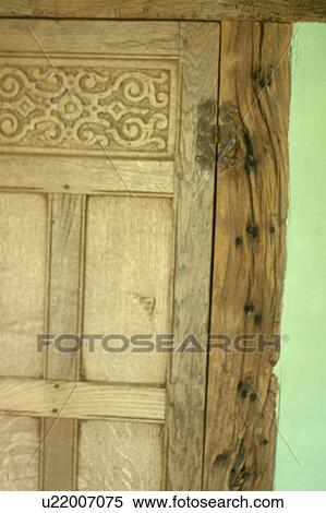 Stock Photography - Close-up of carved wooden Tudor door. Fotosearch