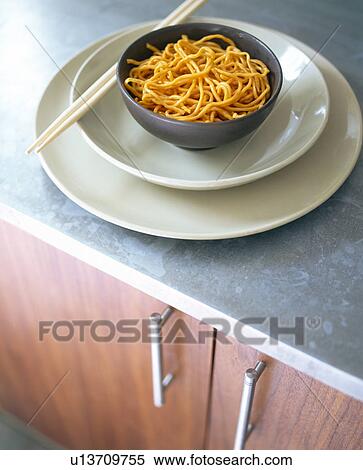 Close-up of Chinese noodles in bowl with chopsticks View Large Photo Image Stock Photography - Close-up of Chinese noodles in bowl with chopsticks. Fotosearch