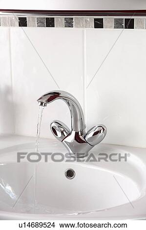 Close-up of chrome mixer tap and white basin View Large Photo Image Picture - Close-up of chrome mixer tap and white basin. Fotosearch