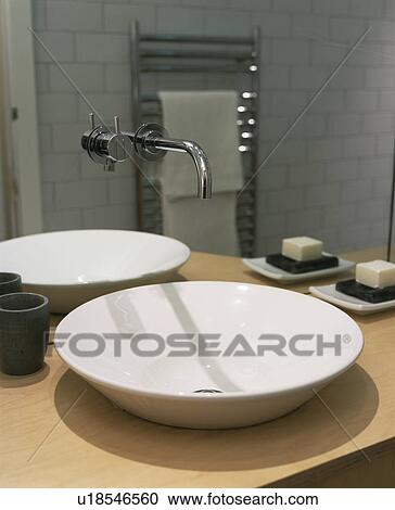 Close-up of chrome tap and modern white basin View Large Photo Image Stock Image - Close-up of chrome tap and modern white basin. Fotosearch